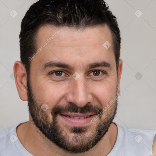 Joyful white adult male with short  brown hair and brown eyes