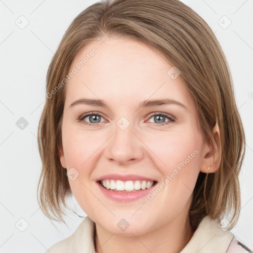 Joyful white young-adult female with medium  brown hair and blue eyes