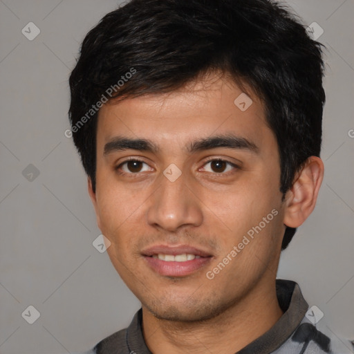 Joyful white young-adult male with short  black hair and brown eyes