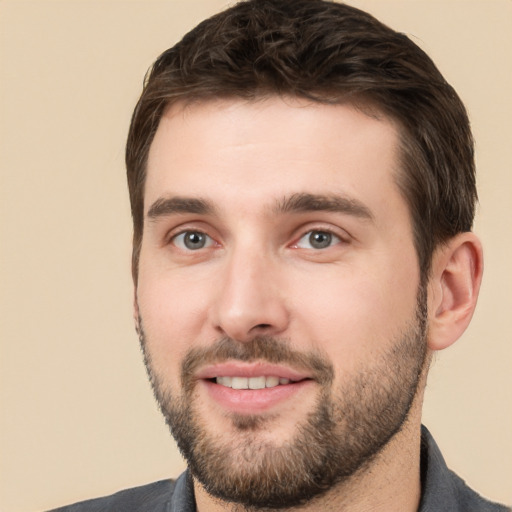 Joyful white young-adult male with short  brown hair and brown eyes