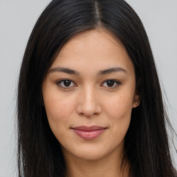 Joyful asian young-adult female with long  brown hair and brown eyes