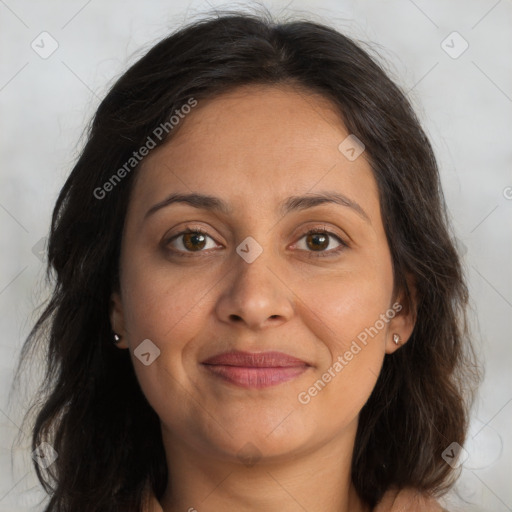 Joyful white adult female with long  brown hair and brown eyes