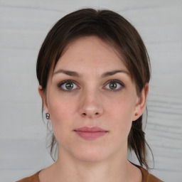 Neutral white young-adult female with short  brown hair and brown eyes