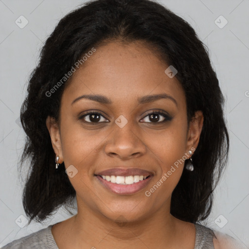 Joyful black young-adult female with medium  brown hair and brown eyes