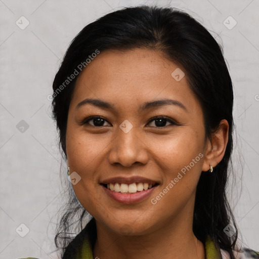 Joyful asian young-adult female with long  brown hair and brown eyes