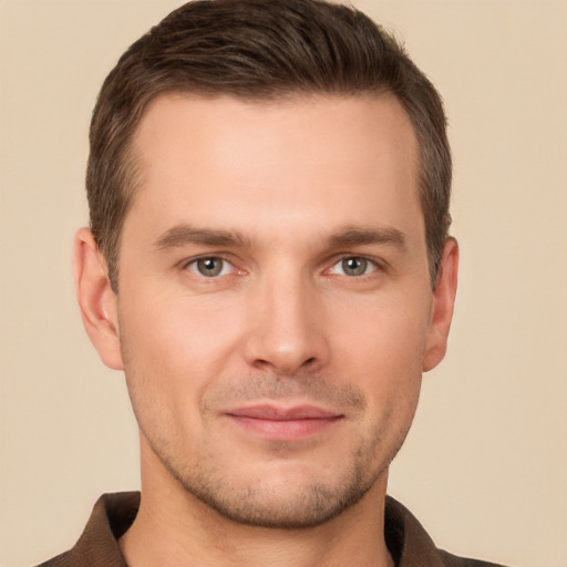 Joyful white young-adult male with short  brown hair and brown eyes