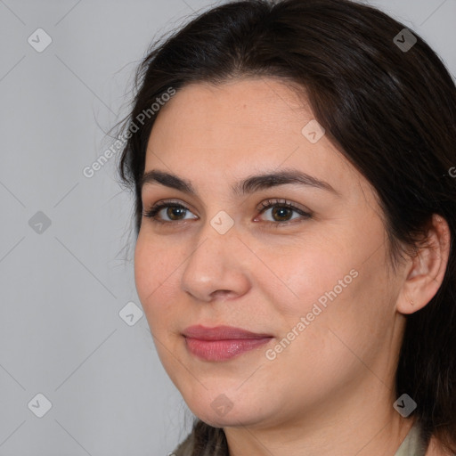 Joyful white young-adult female with medium  brown hair and brown eyes