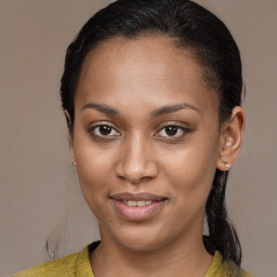 Joyful black young-adult female with medium  brown hair and brown eyes