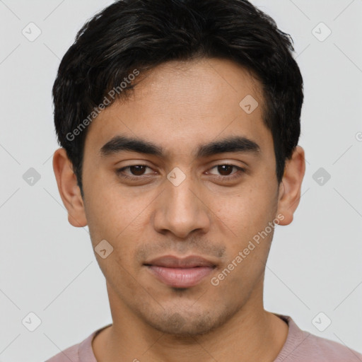 Joyful latino young-adult male with short  black hair and brown eyes