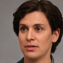 Joyful white adult female with medium  brown hair and brown eyes