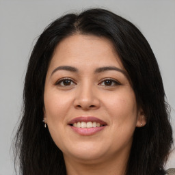 Joyful asian young-adult female with long  brown hair and brown eyes