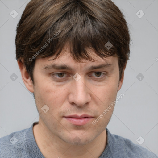 Neutral white adult male with short  brown hair and grey eyes