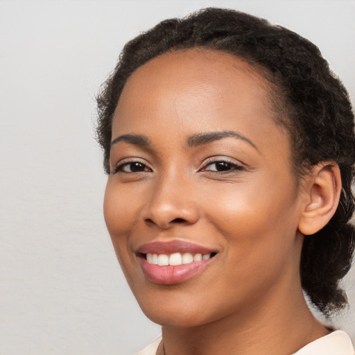 Joyful latino young-adult female with medium  black hair and brown eyes