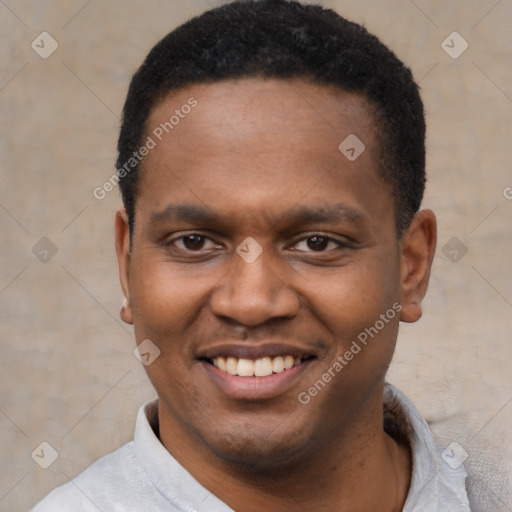 Joyful black young-adult male with short  black hair and brown eyes