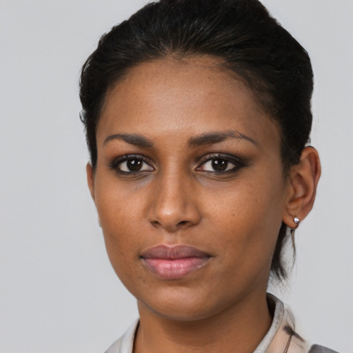 Neutral black young-adult female with short  brown hair and brown eyes