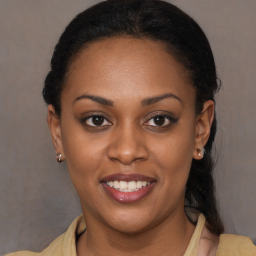 Joyful latino young-adult female with short  brown hair and brown eyes