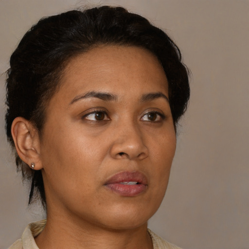 Neutral black young-adult female with medium  brown hair and brown eyes