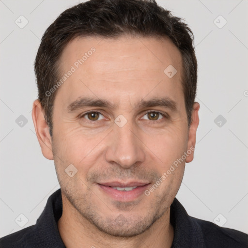 Joyful white adult male with short  brown hair and brown eyes