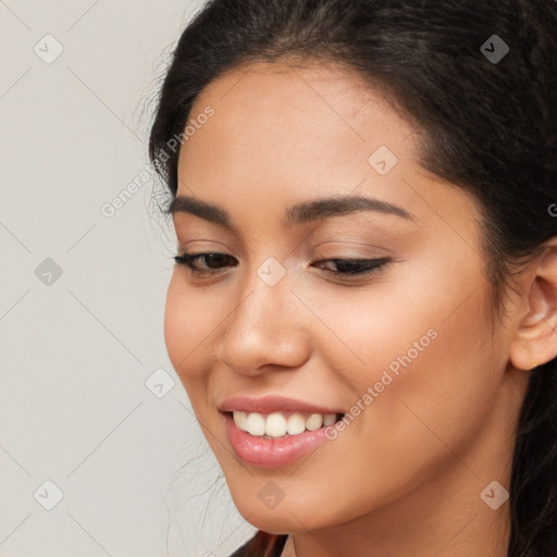 Joyful latino young-adult female with long  brown hair and brown eyes