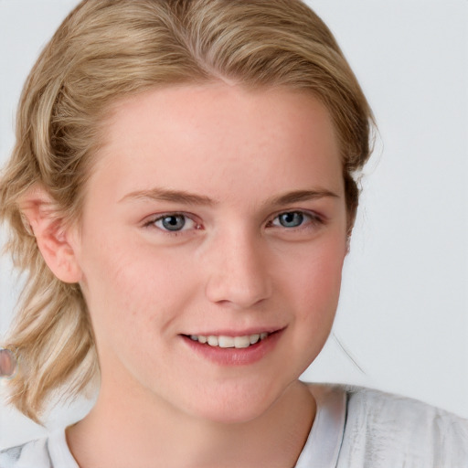 Joyful white young-adult female with medium  brown hair and blue eyes