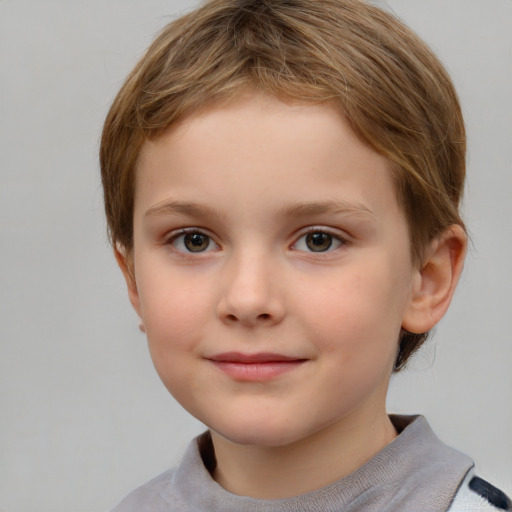 Joyful white child female with short  brown hair and grey eyes