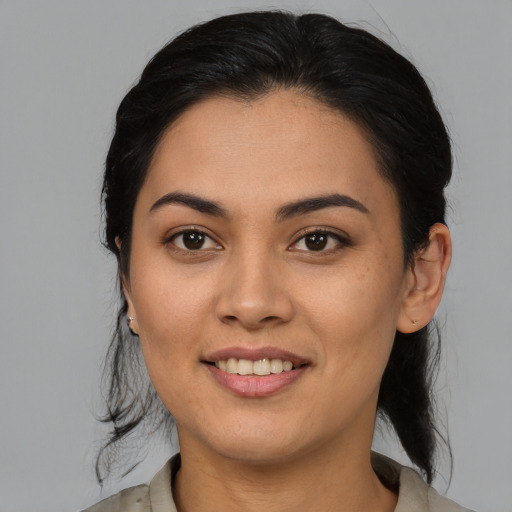 Joyful asian young-adult female with medium  brown hair and brown eyes