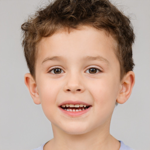 Joyful white child male with short  brown hair and brown eyes