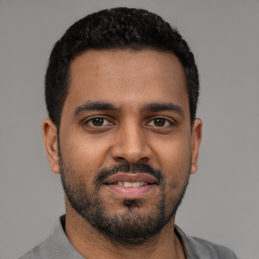 Neutral black young-adult male with short  black hair and brown eyes