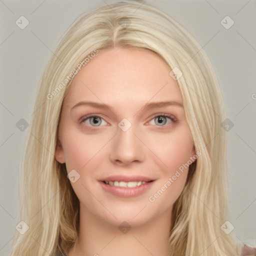 Joyful white young-adult female with long  brown hair and blue eyes