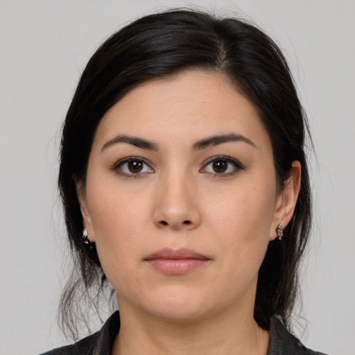 Neutral white young-adult female with medium  black hair and brown eyes