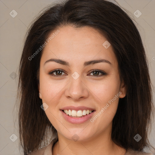 Joyful latino young-adult female with long  brown hair and brown eyes