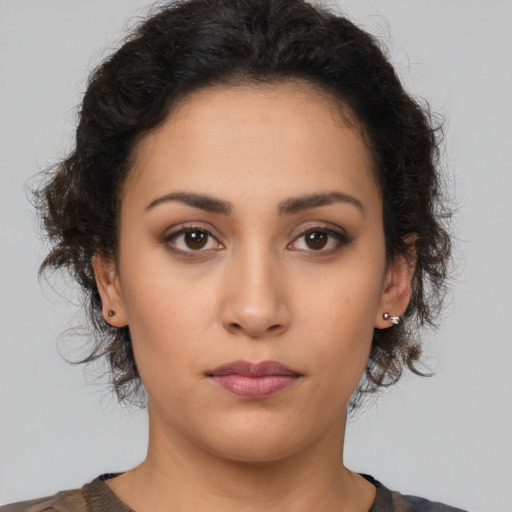 Neutral latino young-adult female with long  brown hair and brown eyes