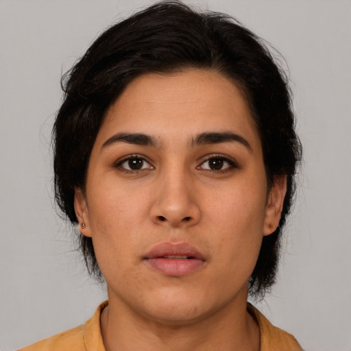 Neutral latino young-adult female with medium  brown hair and brown eyes