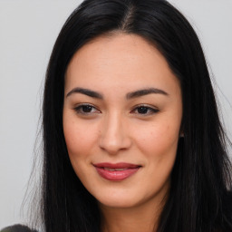 Joyful asian young-adult female with long  brown hair and brown eyes