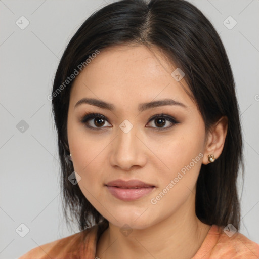 Joyful latino young-adult female with medium  brown hair and brown eyes