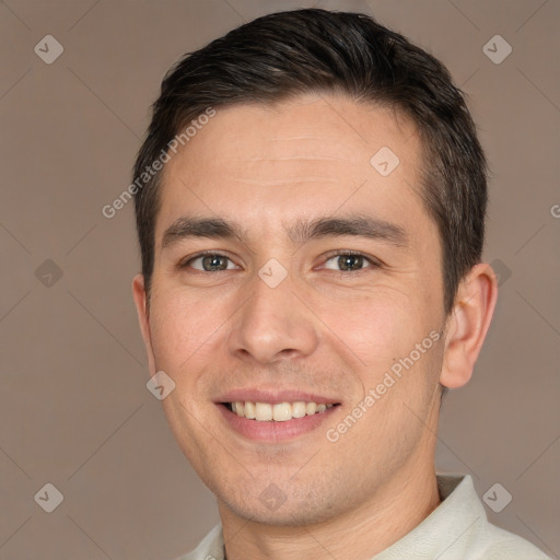 Joyful white young-adult male with short  brown hair and brown eyes