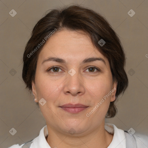 Joyful white adult female with medium  brown hair and brown eyes