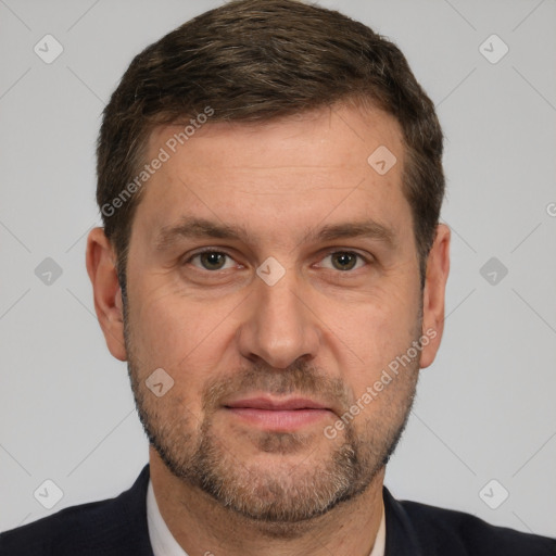 Joyful white adult male with short  brown hair and brown eyes