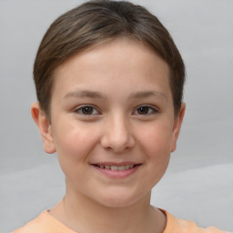 Joyful white child female with short  brown hair and brown eyes