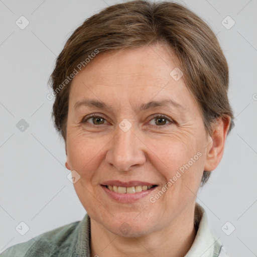 Joyful white adult female with short  brown hair and grey eyes