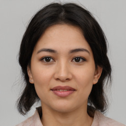 Joyful white young-adult female with medium  brown hair and brown eyes