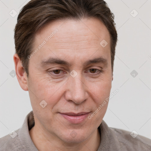 Joyful white adult male with short  brown hair and grey eyes