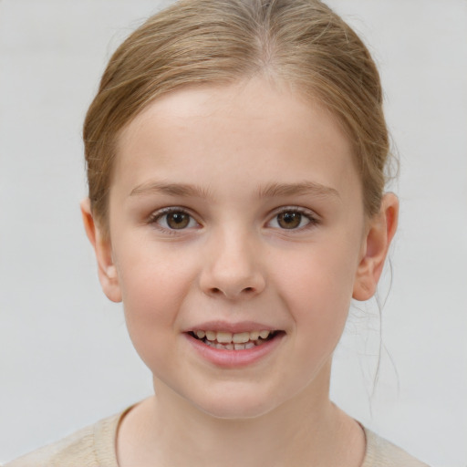 Joyful white child female with short  brown hair and brown eyes