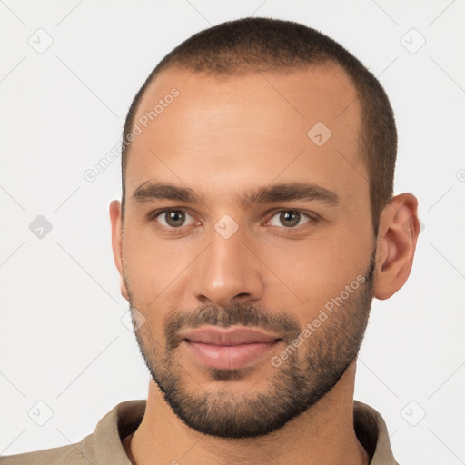 Joyful white young-adult male with short  brown hair and brown eyes