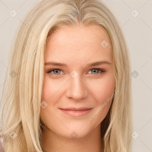 Joyful white young-adult female with long  blond hair and brown eyes