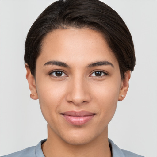 Joyful white young-adult female with short  brown hair and brown eyes