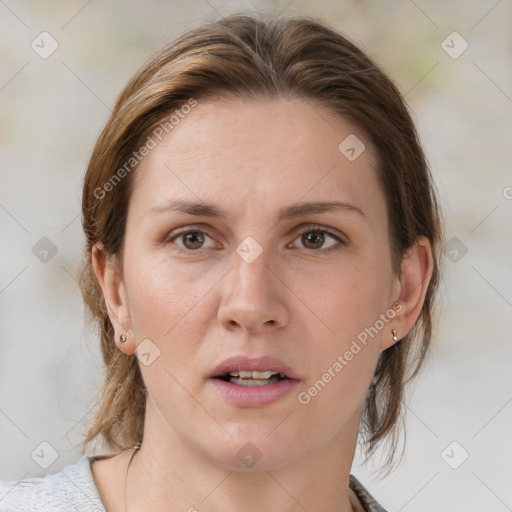 Joyful white adult female with medium  brown hair and grey eyes