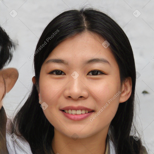 Joyful asian young-adult female with medium  black hair and brown eyes