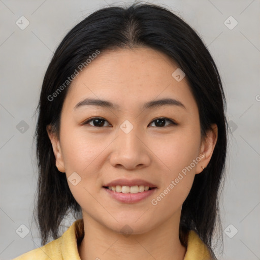 Joyful asian young-adult female with medium  brown hair and brown eyes