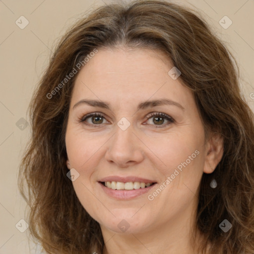 Joyful white adult female with long  brown hair and brown eyes